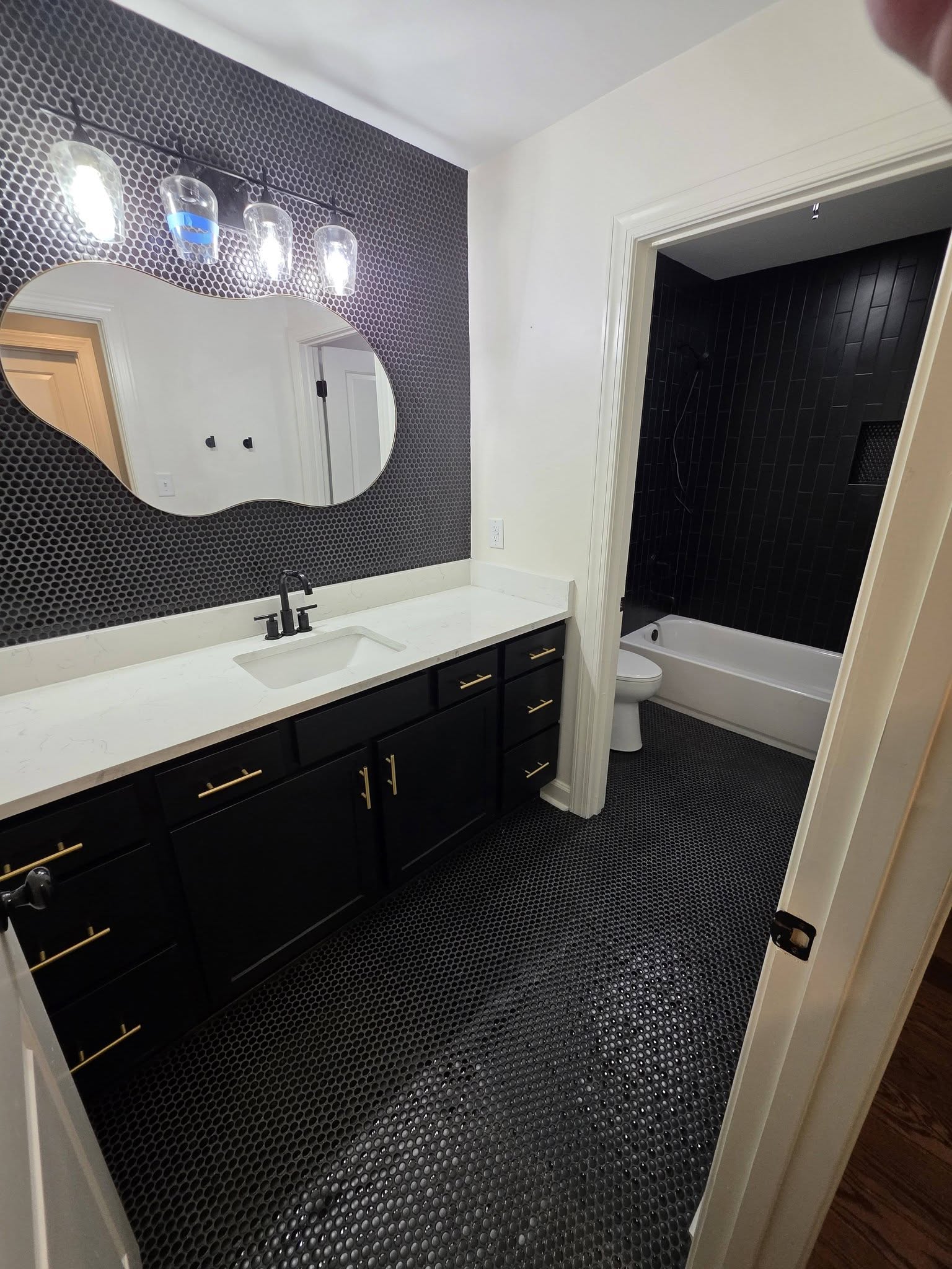 Bathroom remodel with vanity, tile, and paint finishes