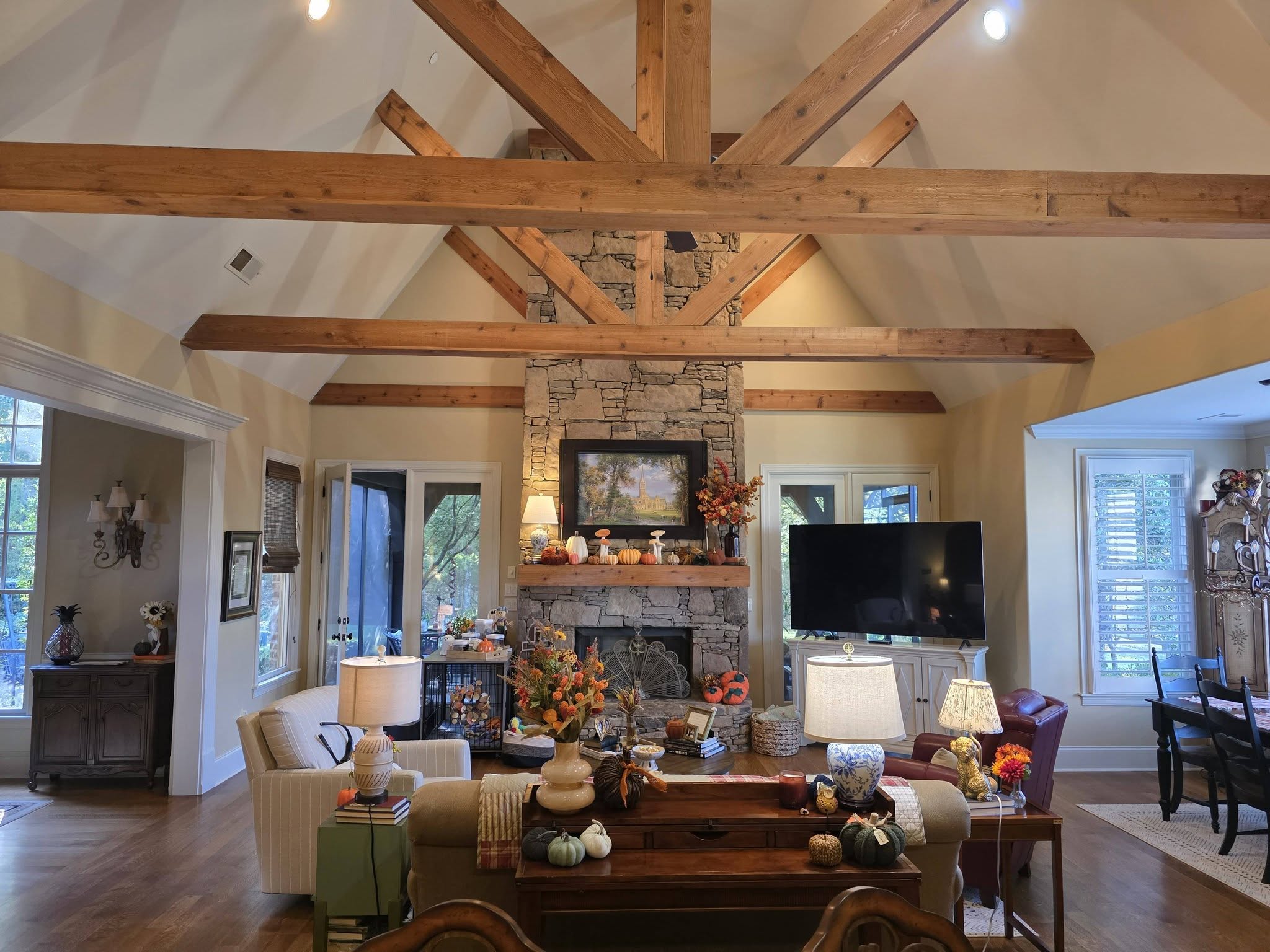 Finished living room renovation with drywall, painting, and hardwood flooring by Roberts Drywall and Renovations