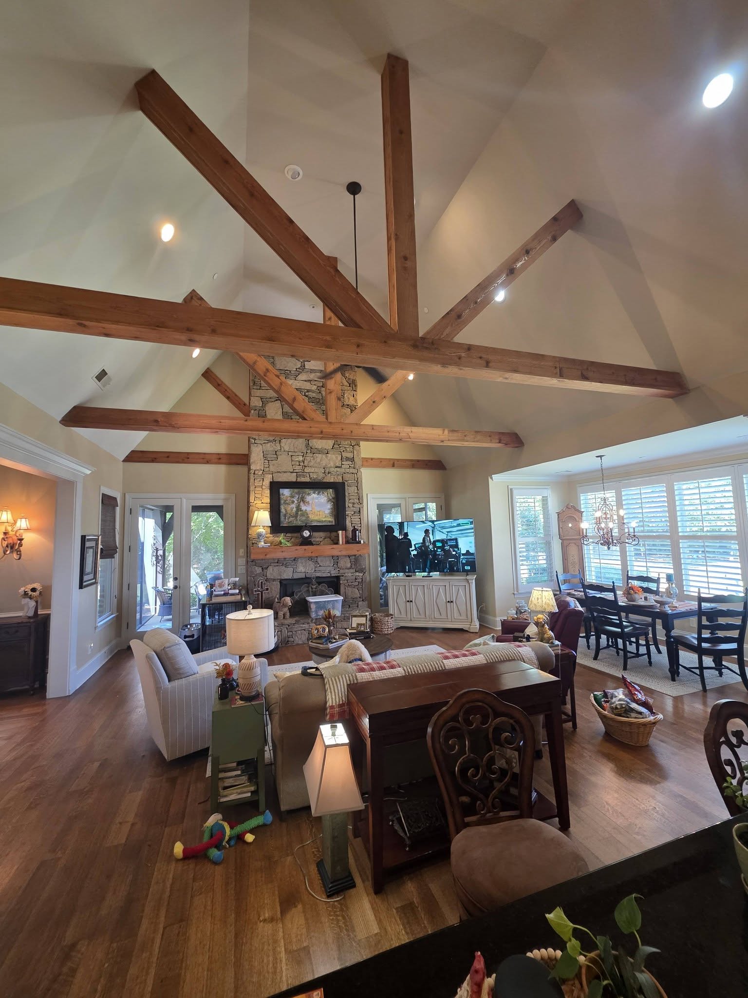 Vaulted living space renovation with painting and flooring