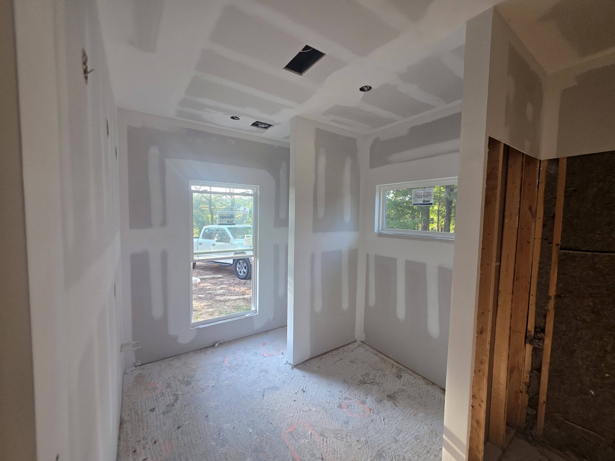 Drywall installation and finishing on a renovation project