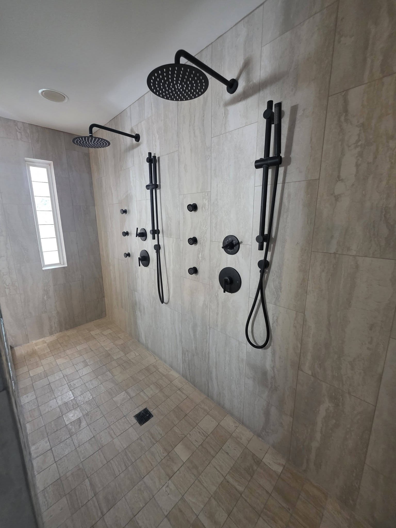 Walk-in shower renovation with stone-look tile